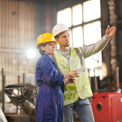 two-workers-inspecting-factory-EDA6L2N.jpg